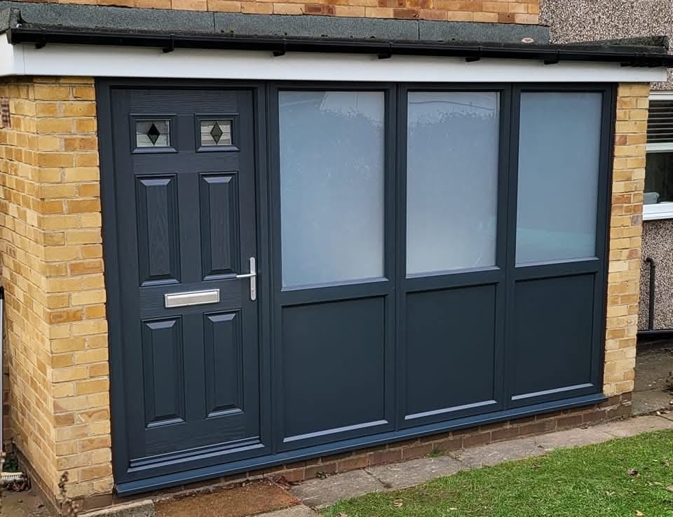 Anthracite grey composite door with uPVC side panels installation