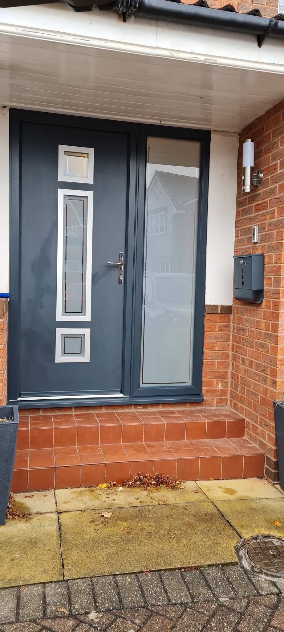 Anthracite grey composite front door with full-height glazed side panel